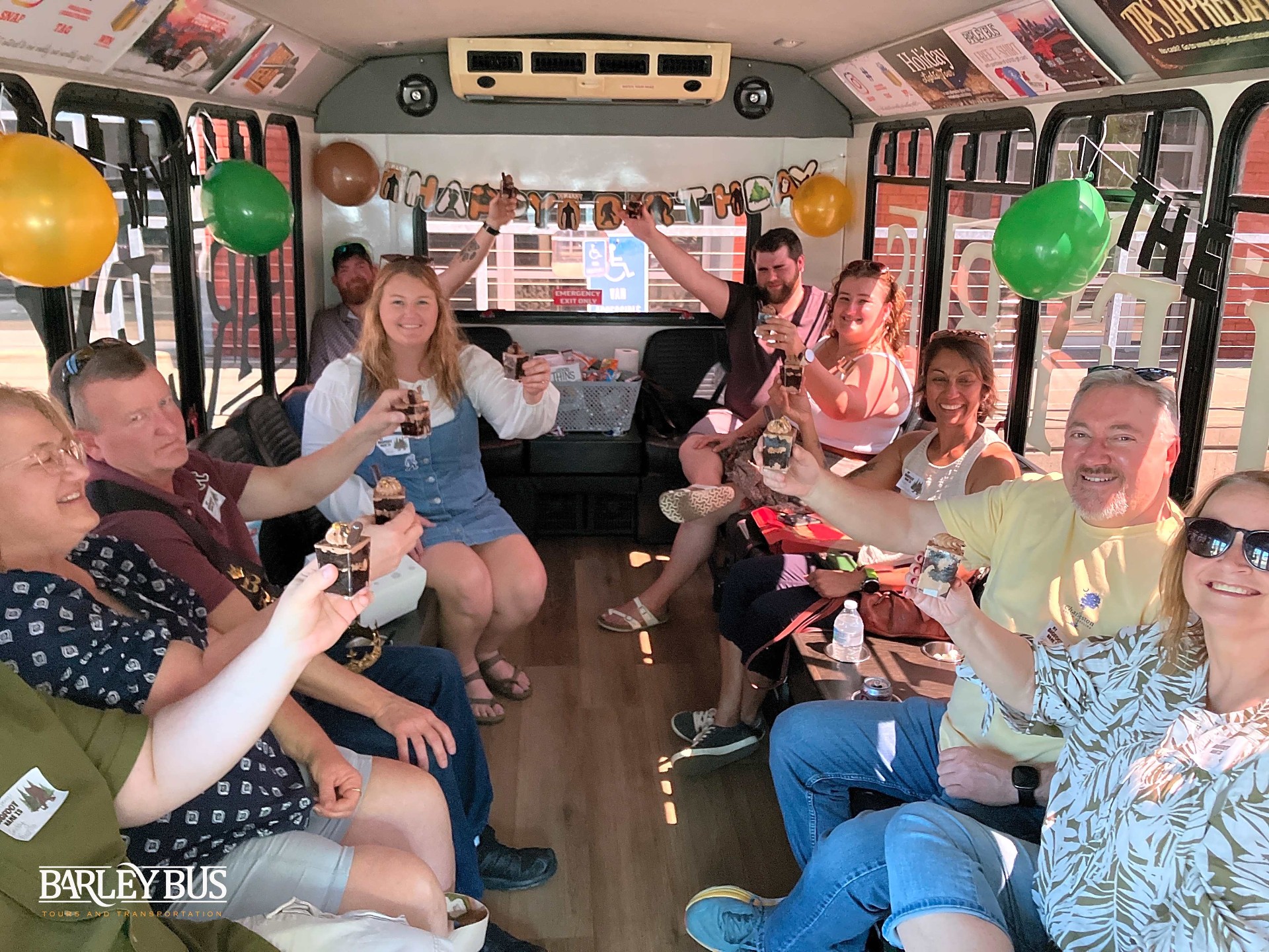 Birthday group celebrating with balloons on the Barley Bus