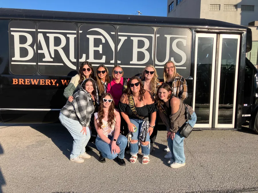 Bachelorette group posing beside the Barley Bus