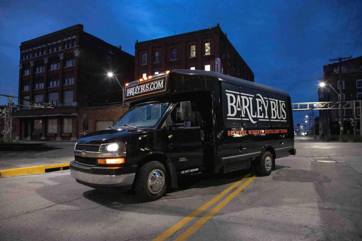14-passenger party bus exterior at night